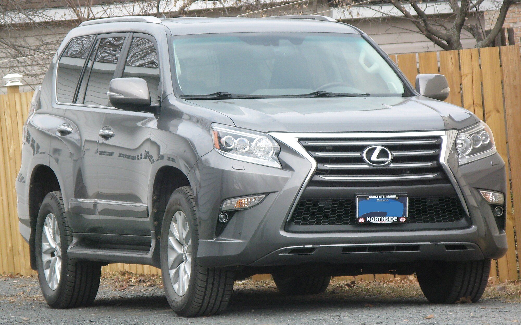 A grey 2014 Lexus GX 460 showing the spindle grille added in the 2014 facelift