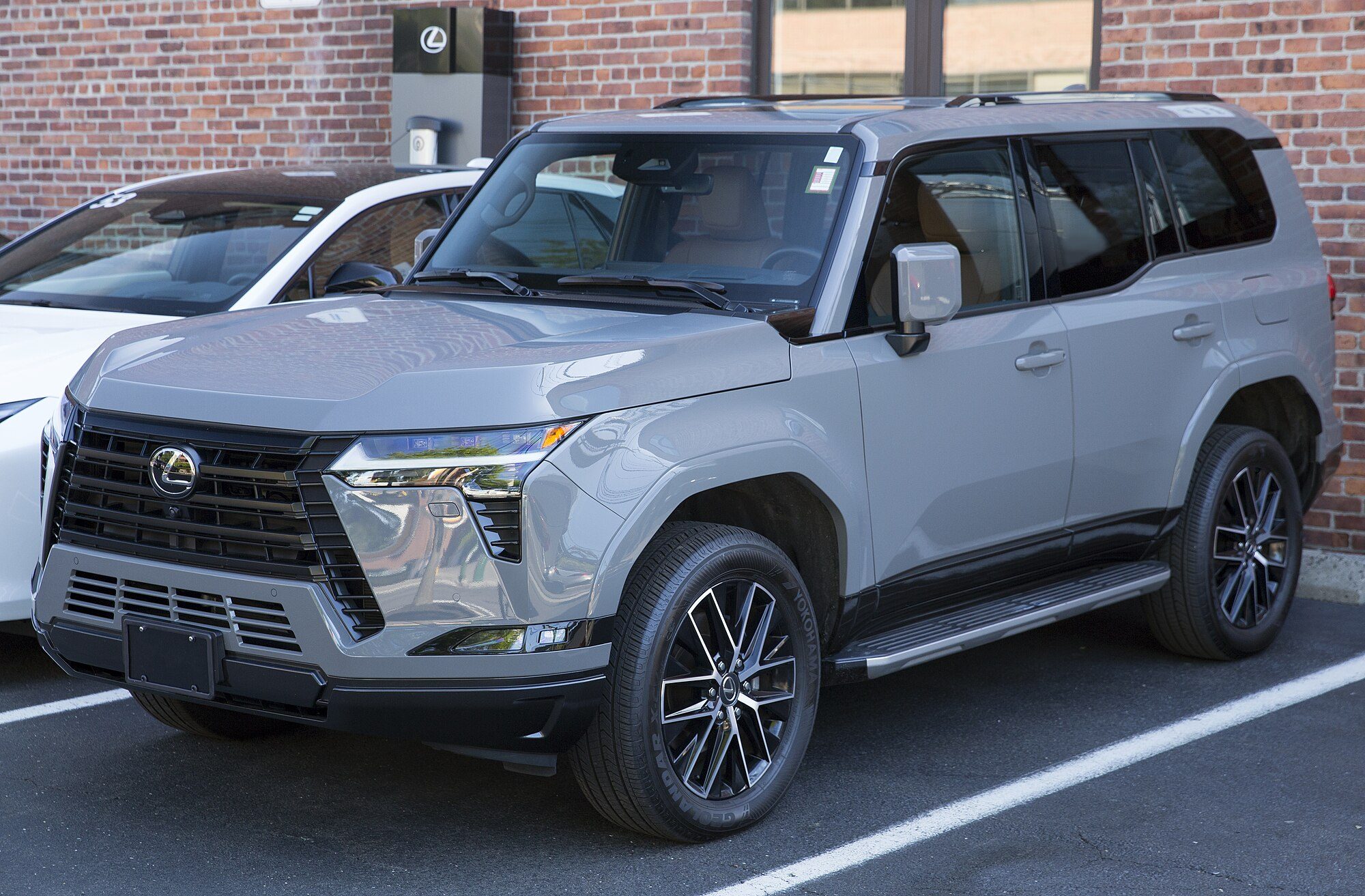 A grey 2025 Lexus GX 550 Premium+ parked in a car park